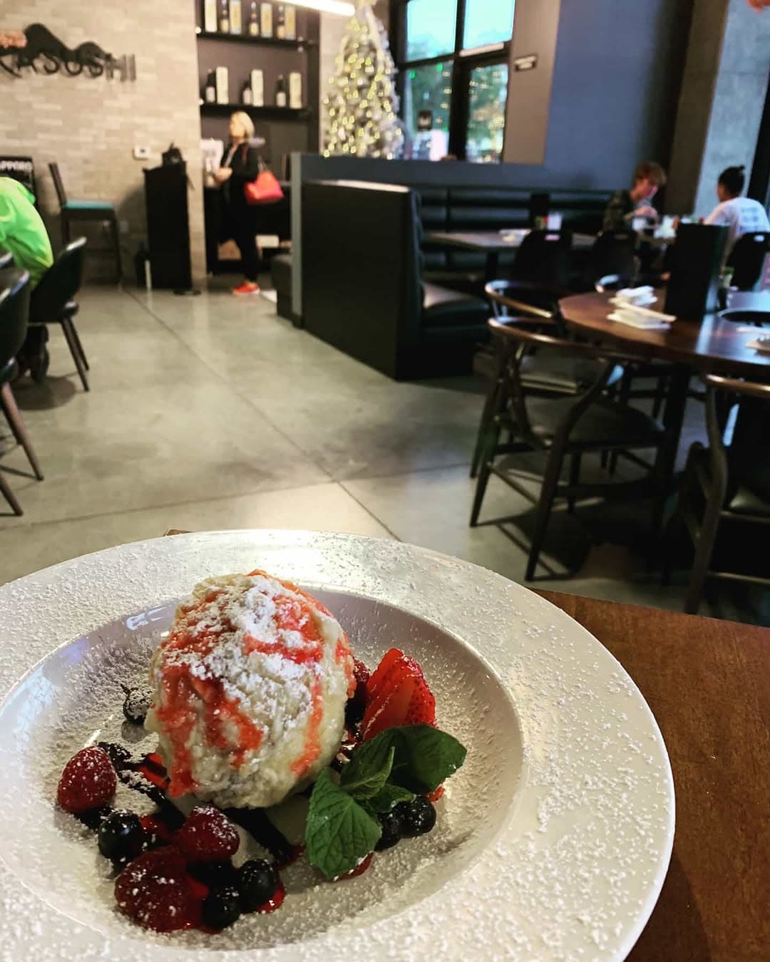 Inside Oka Sushi — the dining room and sushi bar